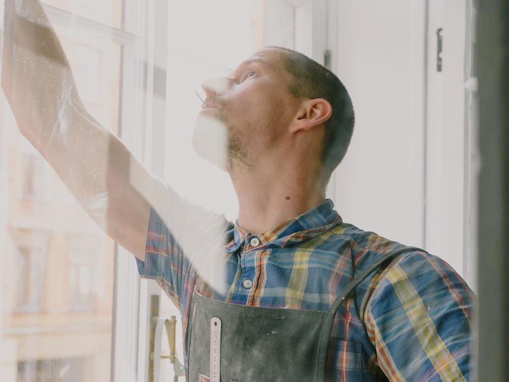 Handyman installing a window