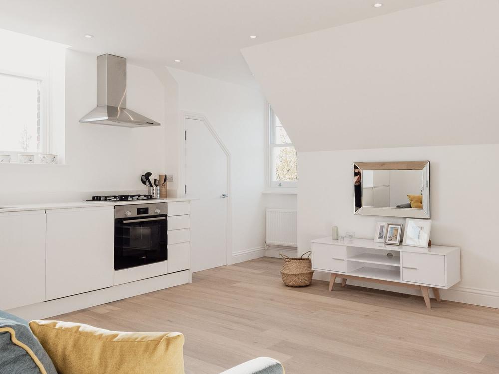 Bright, minimalist kitchen and living space
